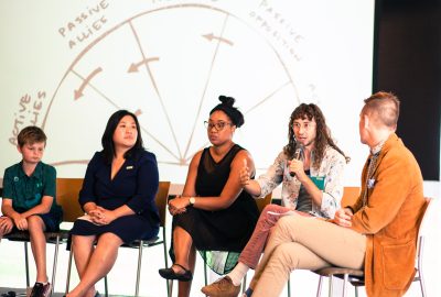 Group of people speak on a panel.